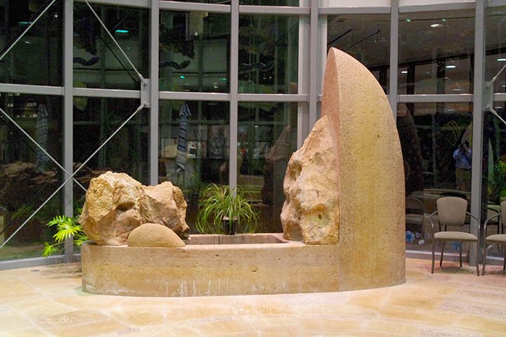 Loss, an asymmetric stone sculpture featuring a trickle of water