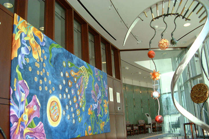 The Science Gallery at Assarian featuring the painting A Short Course in Miracles and a sculpture representing protein production